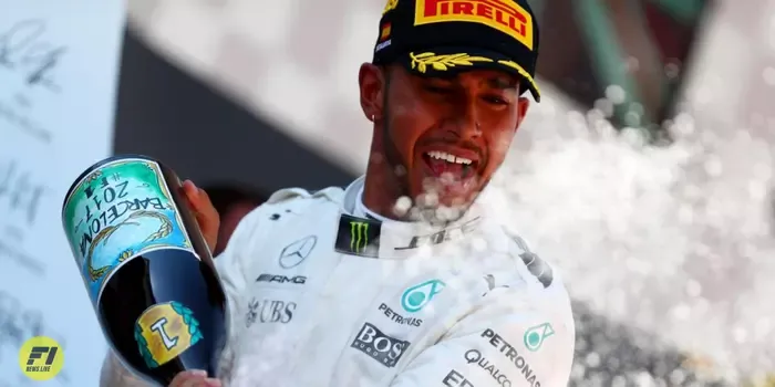 Lewis Hamilton celebrates his win on the podium during the Spanish Grand Prix - Image credit: Eurosport